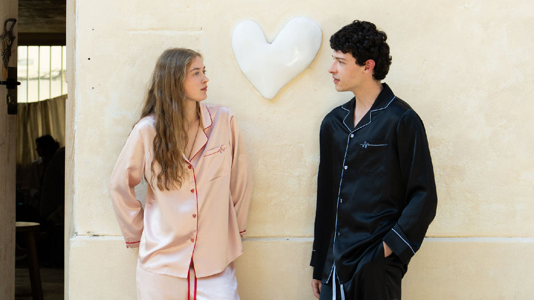 A couple wearing silk pajamas