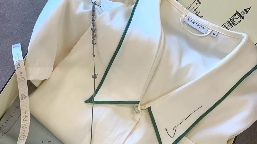 Silk pajama laid inside a gift box.