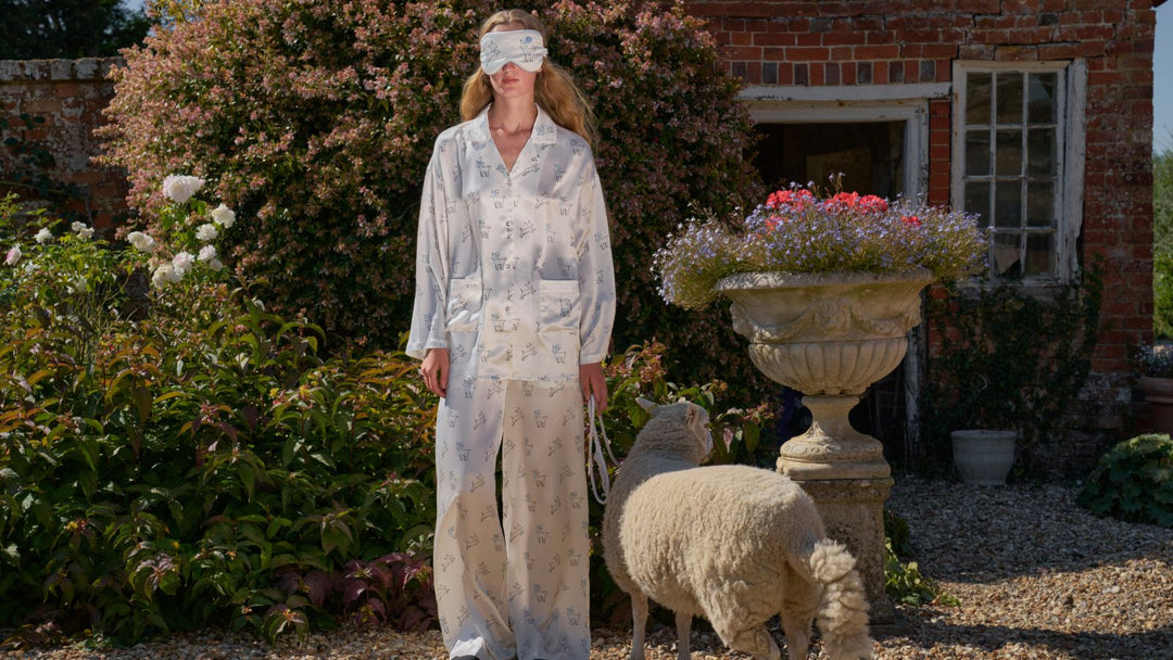 Woman wearing mulberry silk pajamas outdoors in a garden