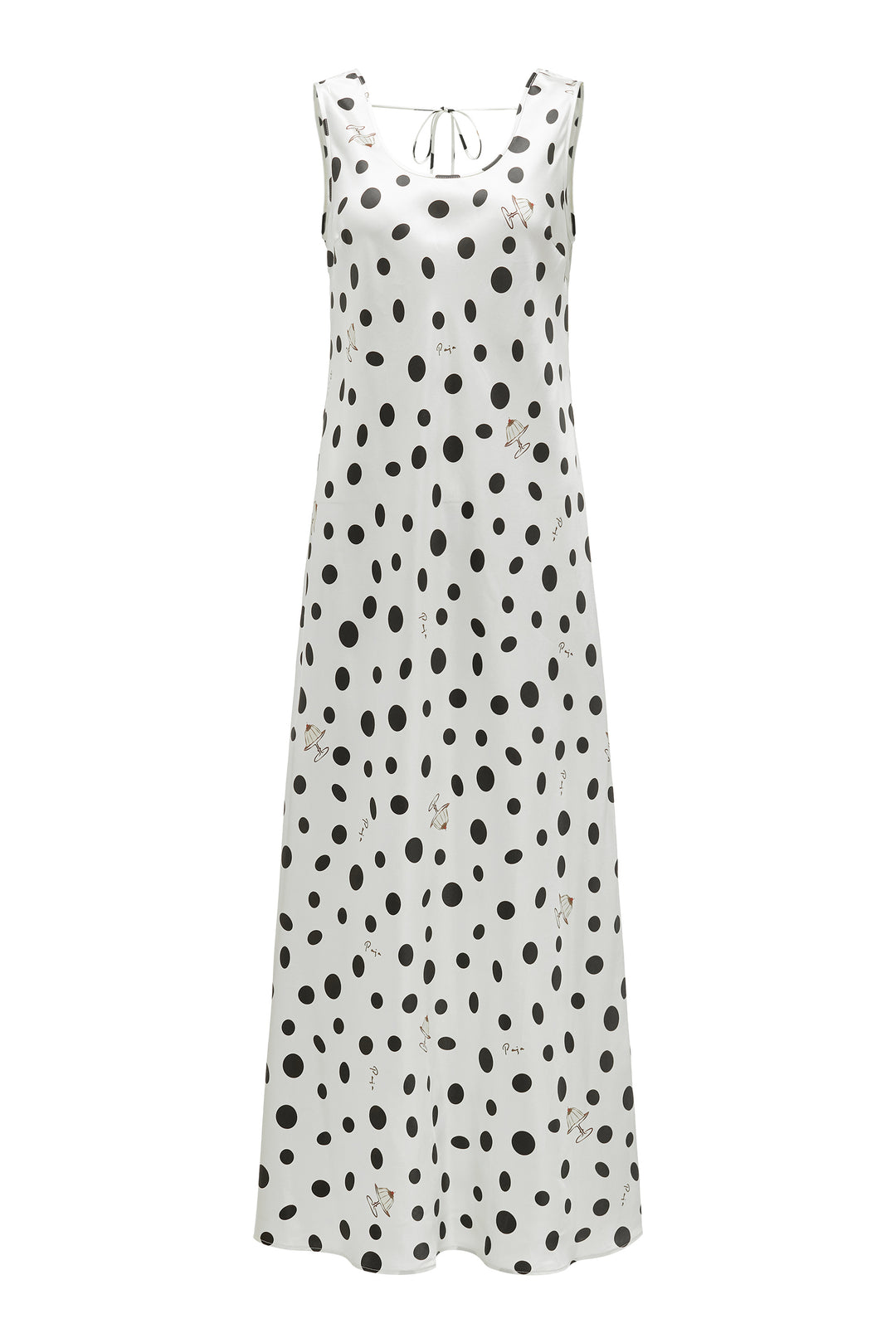 White silk dress with black polka dot pattern on a white background