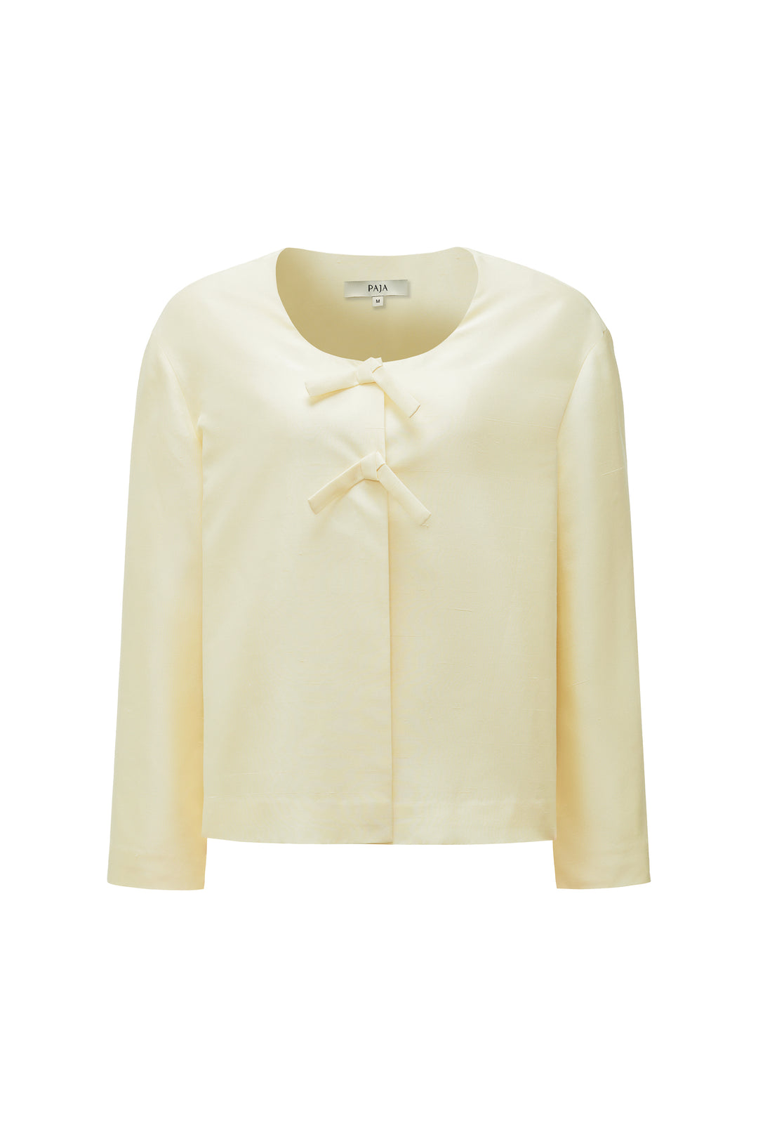 Light yellow silk blouse with a bow detail on a white background