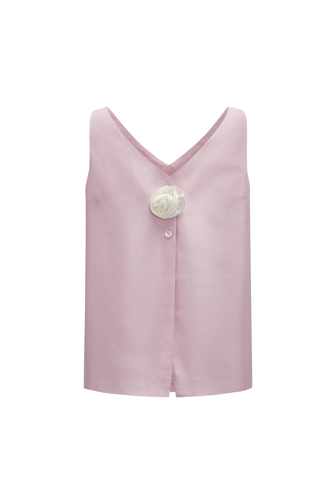 Pink sleeveless top with a white flower and button details on a white background
